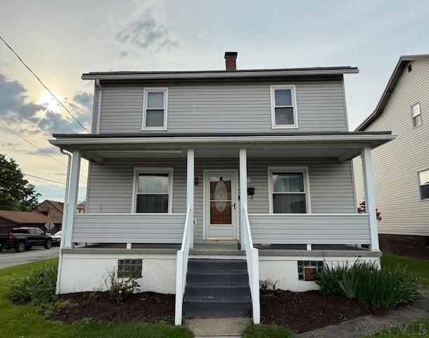 201 7th St, Windber, PA 15963 - view of front of home featuring covered porch and a chimney