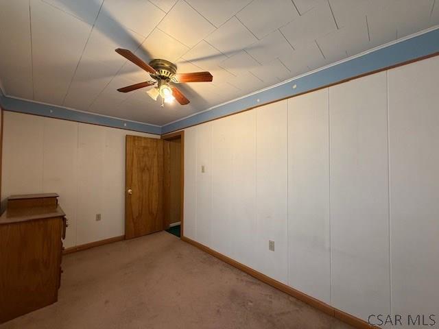 201 7th St, Windber, PA 15963 - carpeted empty room with a ceiling fan and baseboards