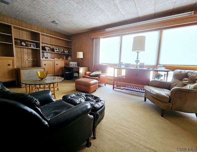 living room with carpet floors, wood walls, and built in features