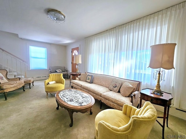 living room featuring carpet floors and a baseboard heating unit