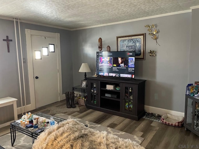 living room with hardwood / wood-style floors and ornamental molding