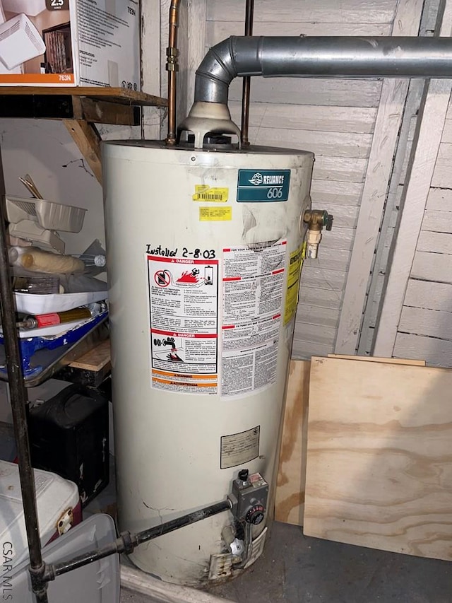 utility room with gas water heater