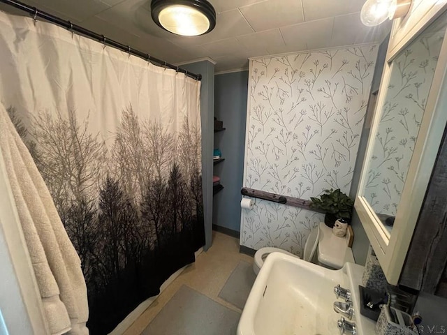 bathroom featuring crown molding and a shower with curtain