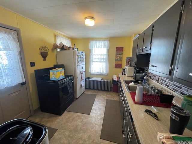 kitchen with radiator and white fridge