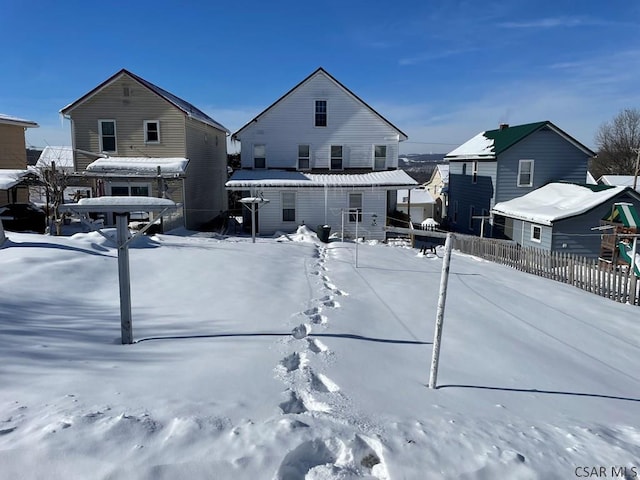 view of snow covered house