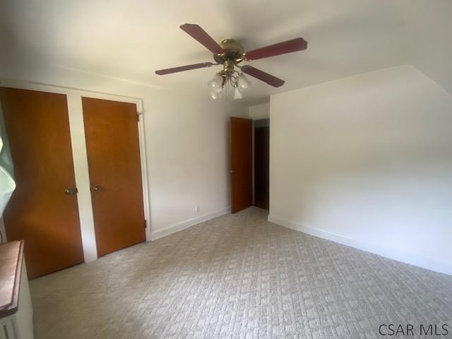 interior space featuring ceiling fan