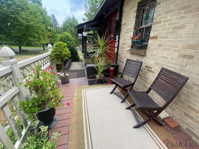 wooden terrace featuring a porch