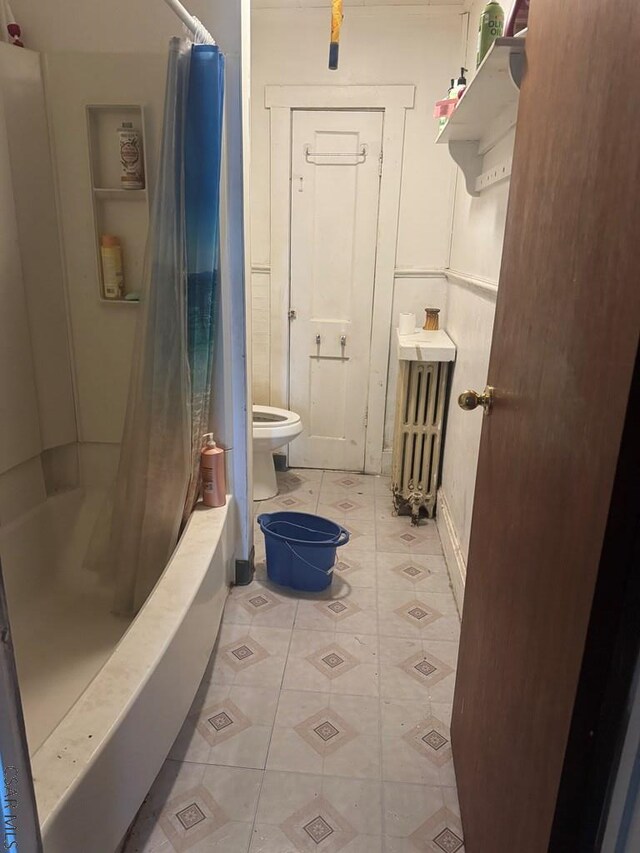 100 Cook St, Johnstown, PA 15906 - bathroom featuring toilet, radiator heating unit, and tile patterned floors