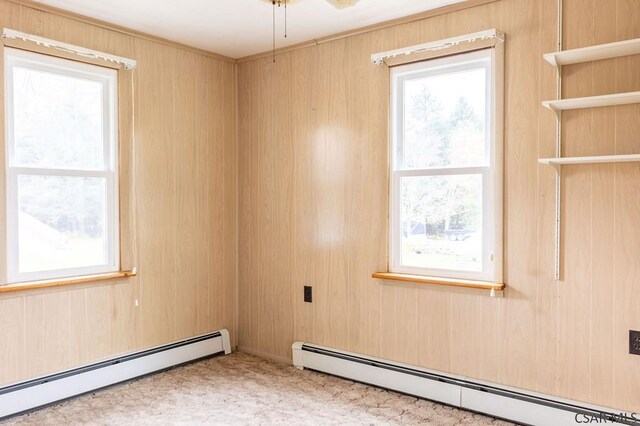 spare room featuring a baseboard heating unit