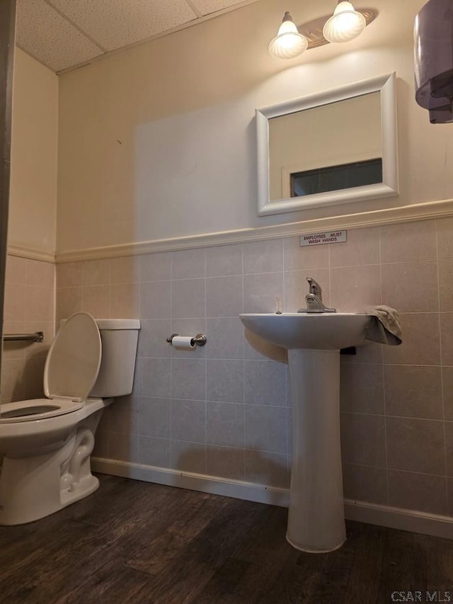 218 Center St, Meyersdale, PA 15552 - bathroom featuring tile walls, toilet, a drop ceiling, and wood finished floors