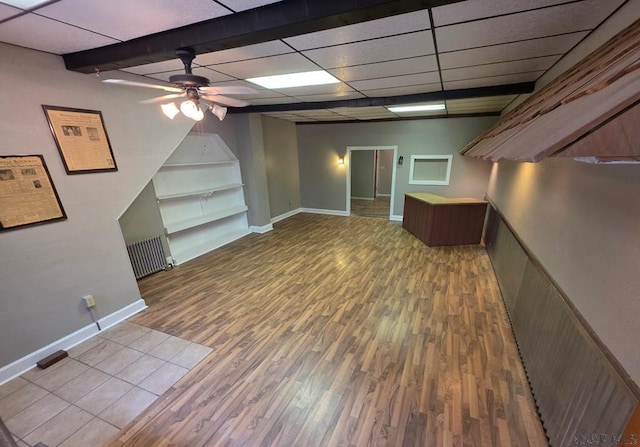218 Center St, Meyersdale, PA 15552 - basement with baseboards, wood finished floors, a ceiling fan, and built in shelves