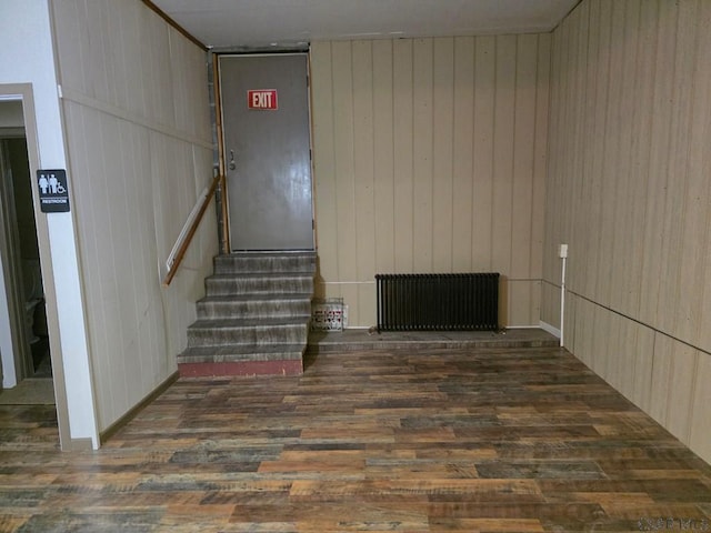 218 Center St, Meyersdale, PA 15552 - interior space featuring radiator, wood walls, and wood finished floors