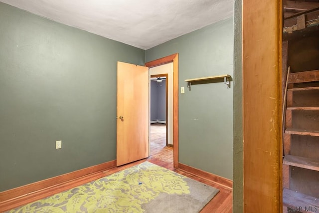 769 Russell Ave, Johnstown, PA 15902 - bedroom featuring wood finished floors and a baseboard radiator