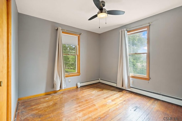 769 Russell Ave, Johnstown, PA 15902 - unfurnished room featuring healthy amount of natural light, hardwood / wood-style floors, ceiling fan, and baseboard heating