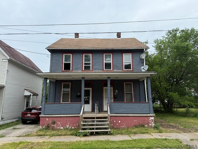 717-719 Messenger St, Johnstown, PA 15902 - view of front facade featuring a porch and a chimney
