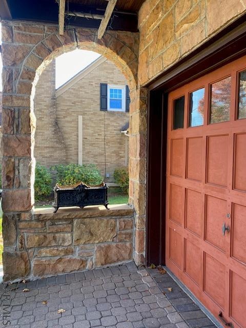 property entrance with a garage