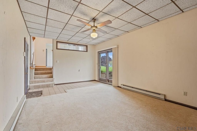 527 Patton St, Somerset, PA 15501 - spare room with baseboard heating, carpet floors, a drop ceiling, a ceiling fan, and stairway