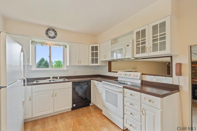 527 Patton St, Somerset, PA 15501 - kitchen featuring white appliances, a sink, dark countertops, backsplash, and glass insert cabinets