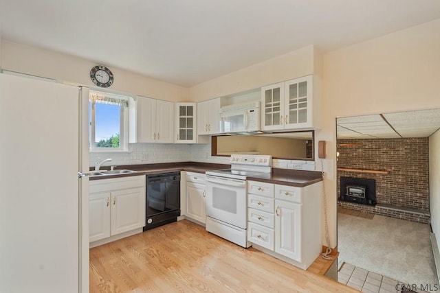 527 Patton St, Somerset, PA 15501 - kitchen featuring white appliances, dark countertops, a sink, and white cabinets