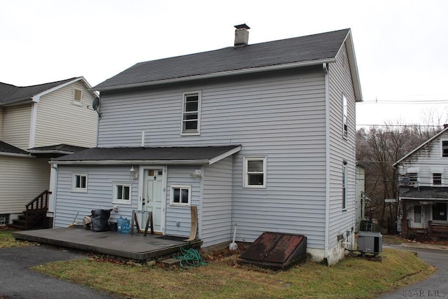 back of property featuring central air condition unit