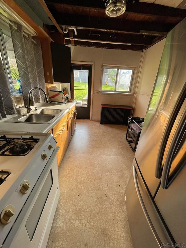 115 N St, Johnstown, PA 15906 - kitchen featuring a sink, white range with gas stovetop, and light countertops