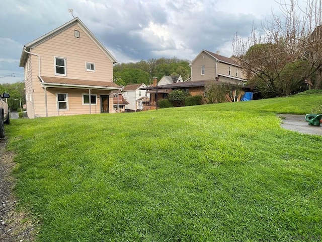115 N St, Johnstown, PA 15906 - rear view of house featuring a lawn