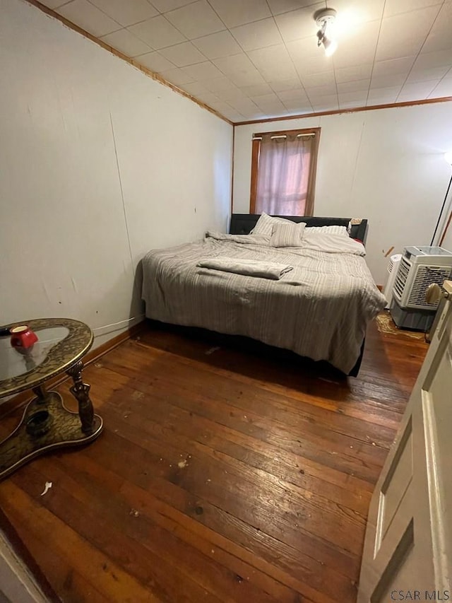 115 N St, Johnstown, PA 15906 - bedroom with a wall mounted AC, ornamental molding, and hardwood / wood-style flooring