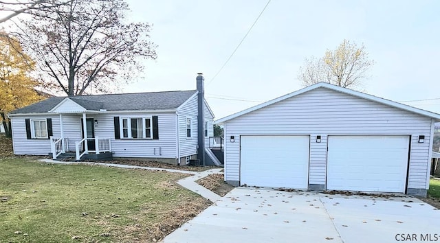 ranch-style home with a garage and a front lawn