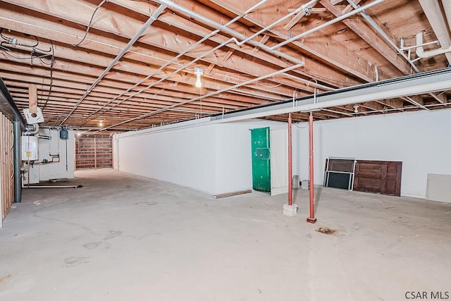 unfinished basement with water heater