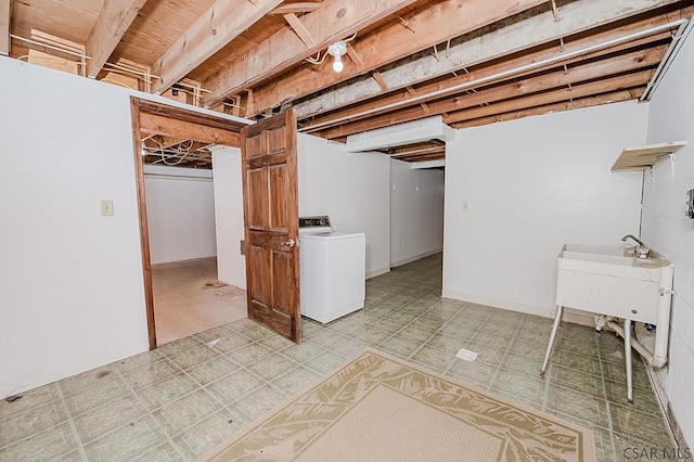 unfinished basement featuring washer / clothes dryer and light floors