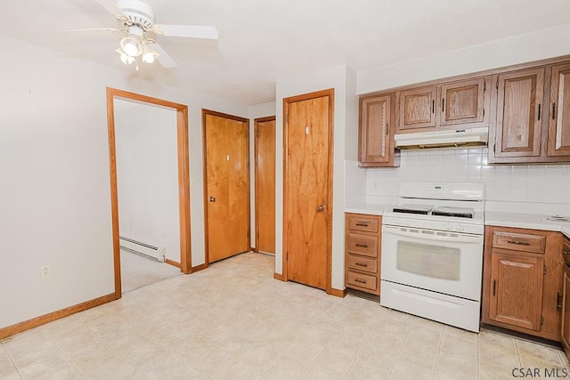 kitchen featuring under cabinet range hood, a baseboard heating unit, white range with gas cooktop, light countertops, and backsplash