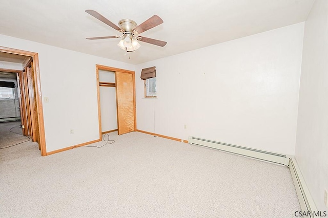 unfurnished bedroom with a baseboard radiator, a baseboard heating unit, baseboards, baseboard heating, and a closet