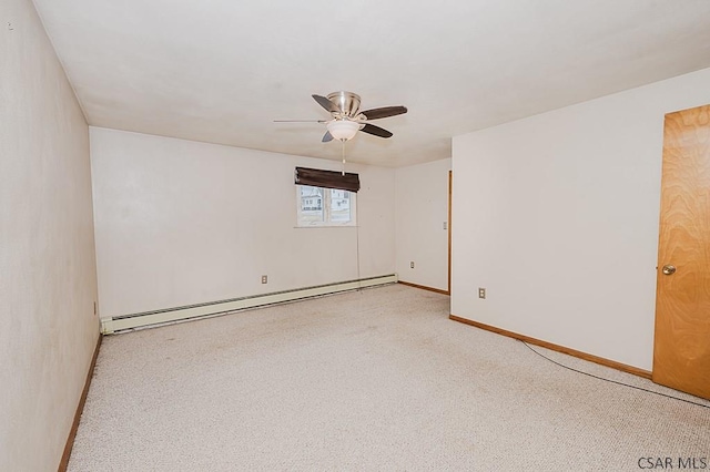 carpeted empty room featuring baseboard heating, a ceiling fan, and baseboards