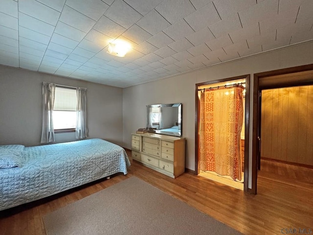 bedroom with hardwood / wood-style flooring