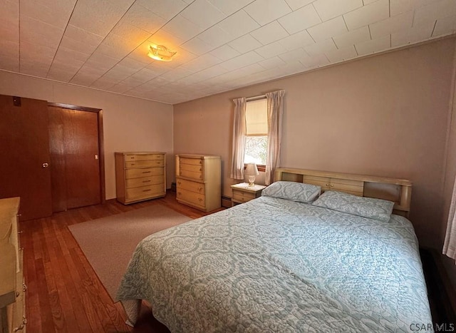 bedroom with light wood-type flooring