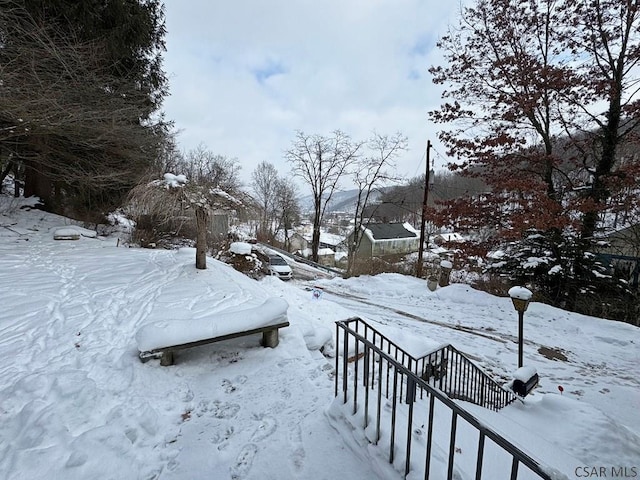 view of yard covered in snow