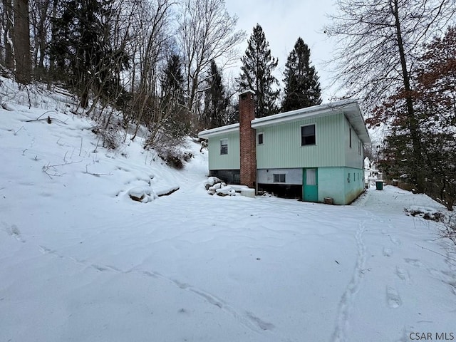 view of snow covered property