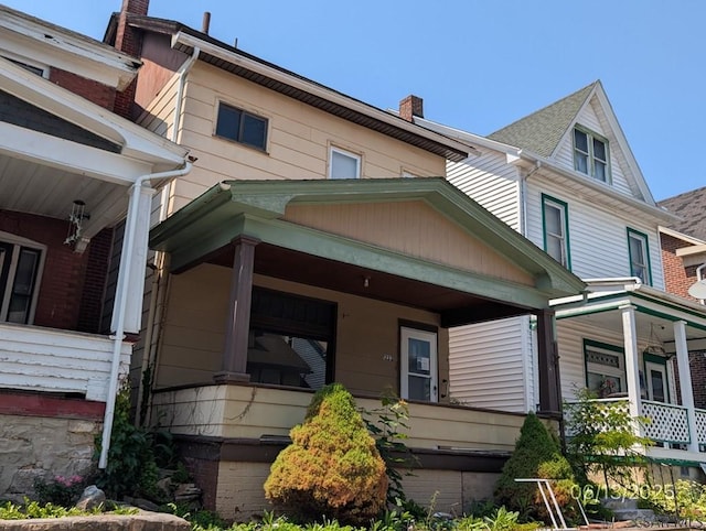 1222 19th Ave, Altoona, PA 16601 - view of home's exterior featuring covered porch and a chimney