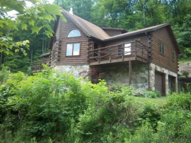 view of side of home featuring a garage