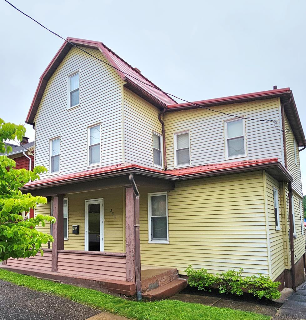 231 Spring St, Johnstown, PA 15906 - rear view of property with covered porch and metal roof