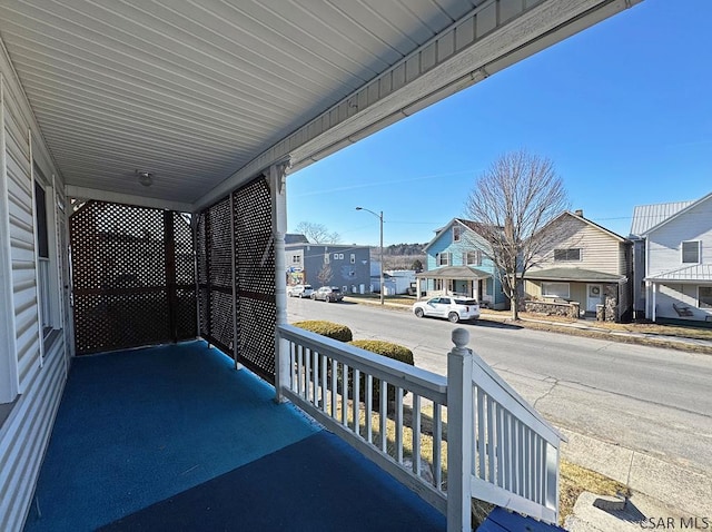 balcony featuring a porch and a residential view