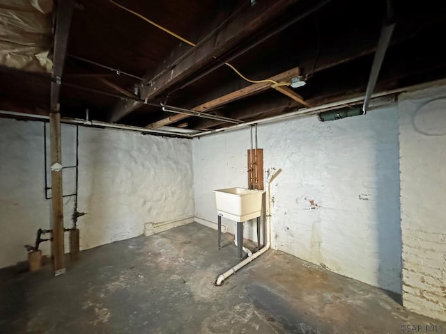 unfinished basement featuring a sink