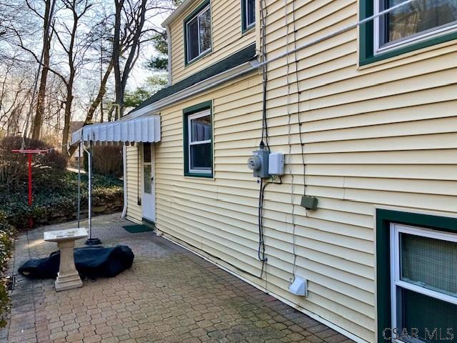 view of property exterior featuring a patio area