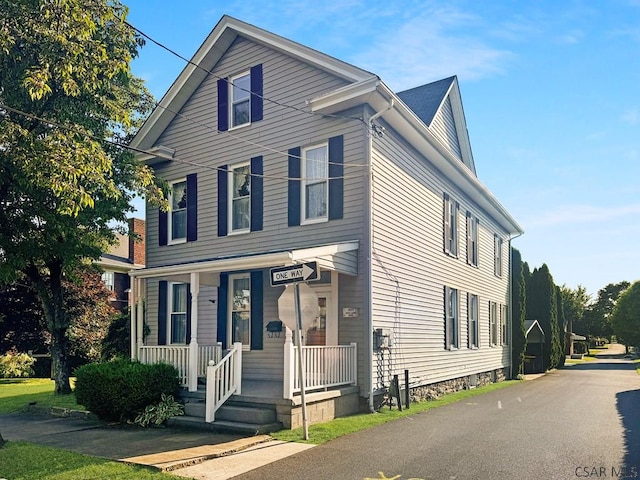 view of property with covered porch