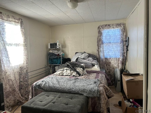 bedroom with light tile patterned floors