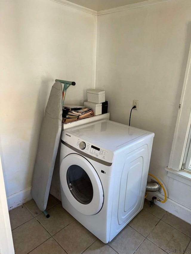 washroom featuring washer / dryer and light tile patterned floors