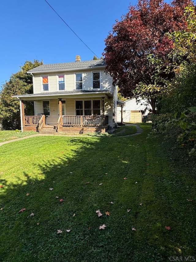 back of house featuring a yard and a porch