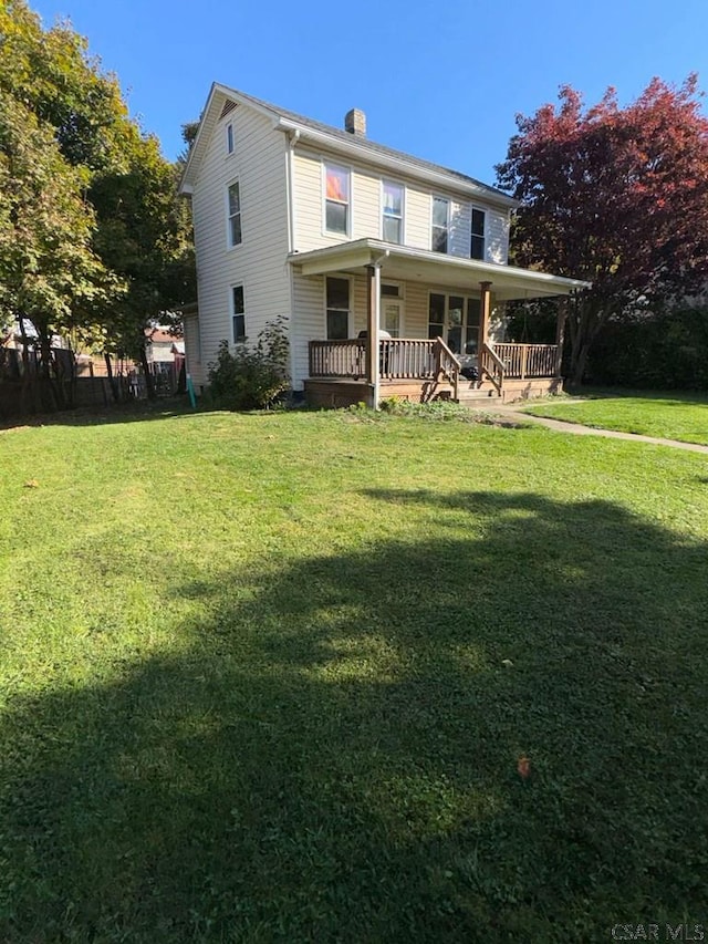 view of front of house featuring a front yard and covered porch