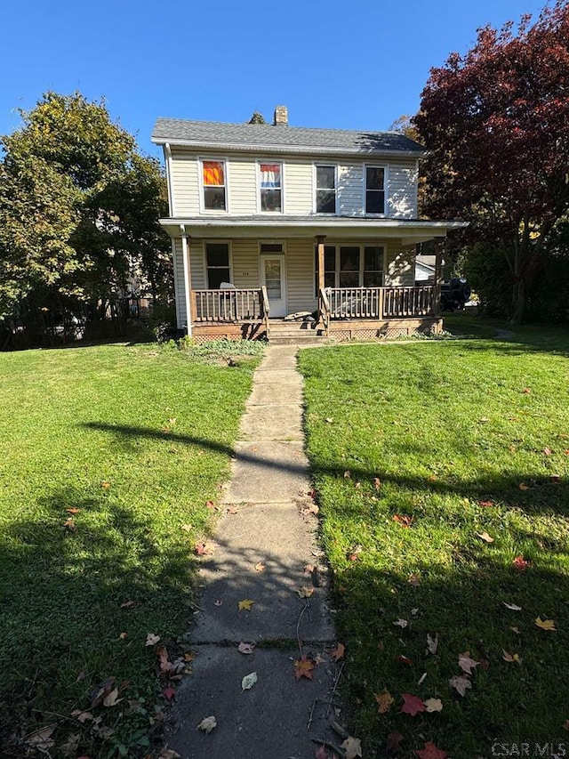 view of front facade with a porch and a front yard