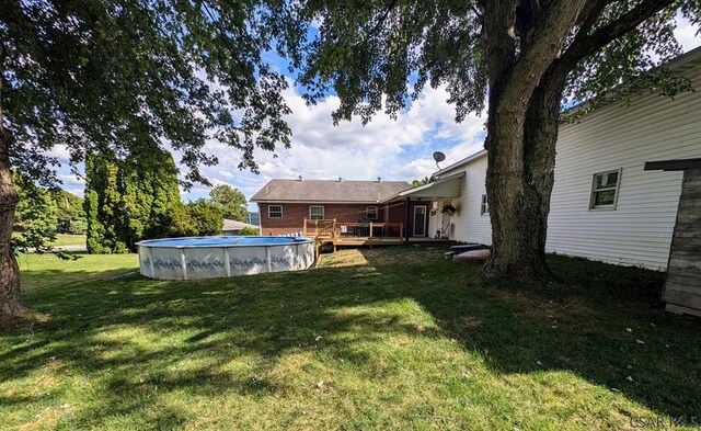 view of yard featuring a pool side deck